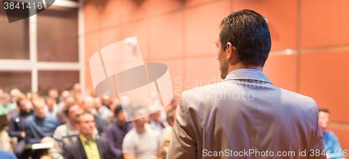 Image of Speaker at Business Conference and Presentation.