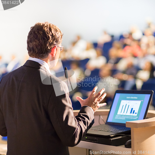 Image of Speaker at Business Conference and Presentation.