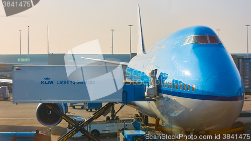 Image of KLM plane being loaded at Schiphol Airport. Amsterdam, Netherlands