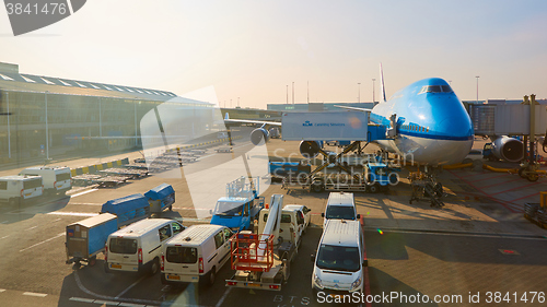 Image of KLM plane being loaded at Schiphol Airport. Amsterdam, Netherlands