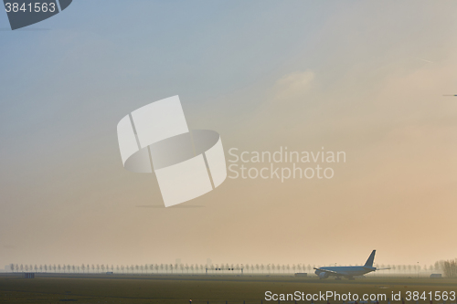Image of  Airplane departing from Airport Schiphol.