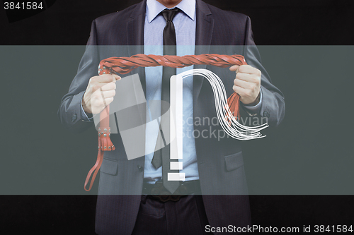 Image of man in business suit with chained hands. handcuffs for sex games. concept of erotic entertainment.