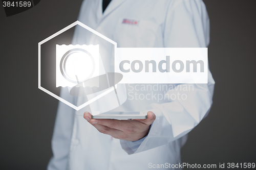 Image of Doctor working on a virtual screen. medical technology concept. condom