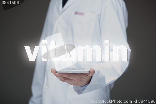 Image of Doctor working on a virtual screen. medical technology concept. vitamin