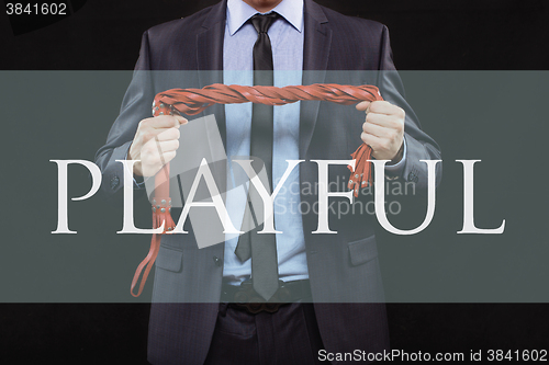 Image of man in business suit with chained hands. handcuffs for sex games. concept of erotic entertainment. playful