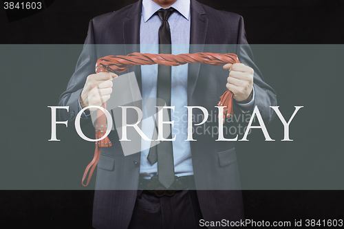 Image of man in business suit with chained hands. handcuffs for sex games. concept of erotic entertainment. foreplay