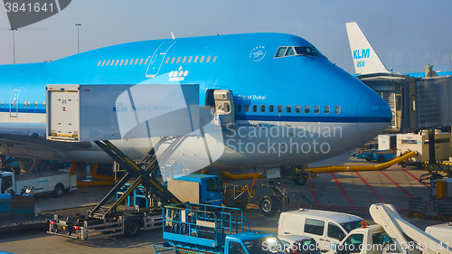 Image of KLM plane being loaded at Schiphol Airport. Amsterdam, Netherlands