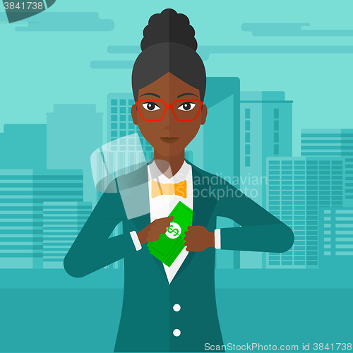 Image of Woman putting money in pocket.