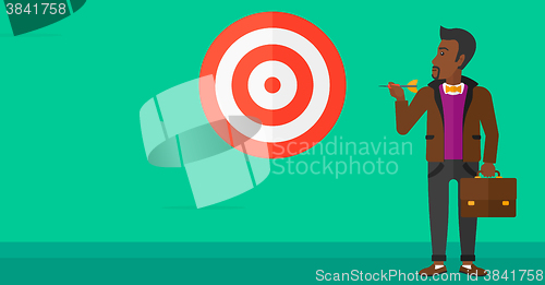 Image of Businessman with target board.