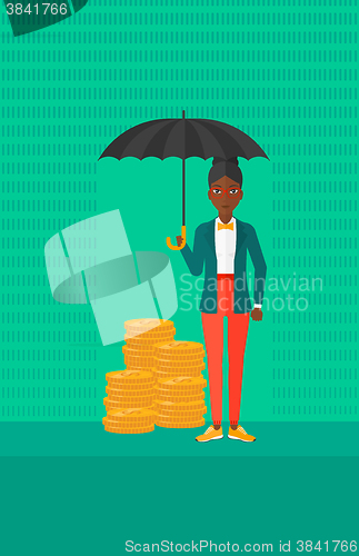 Image of Woman with umbrella protecting money.