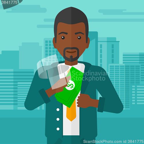 Image of Man putting money in pocket.