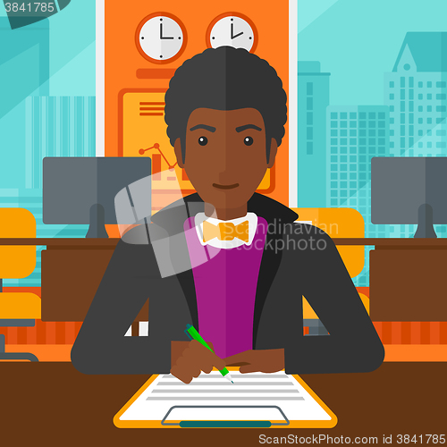 Image of Man signing contract.