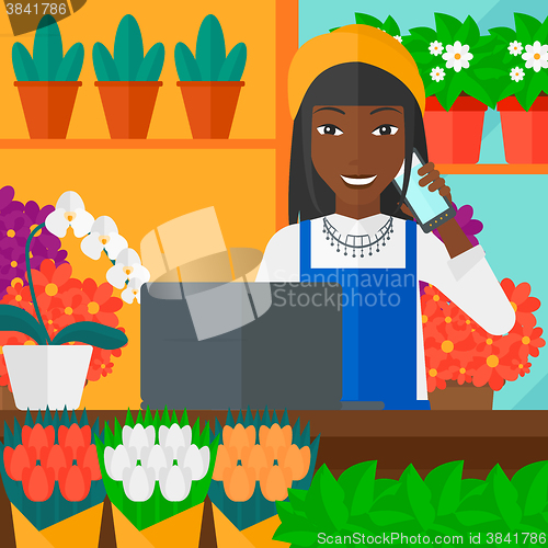 Image of Florist taking order.