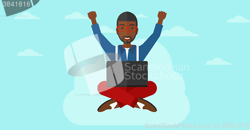 Image of Man sitting on cloud with laptop.