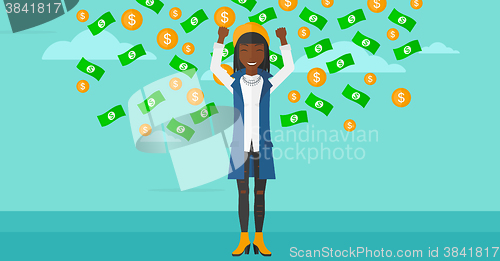 Image of Happy woman with  flying money. 