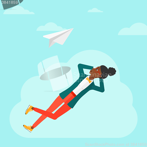 Image of Business woman relaxing on cloud.