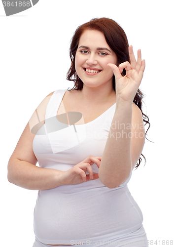 Image of plus size woman in underwear showing ok hand sign