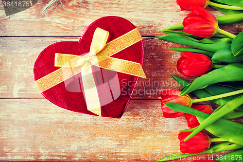 Image of close up of red tulips and chocolate box