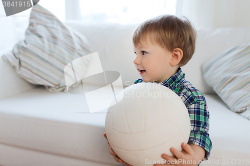 Image of happy little baby boy with ball at home