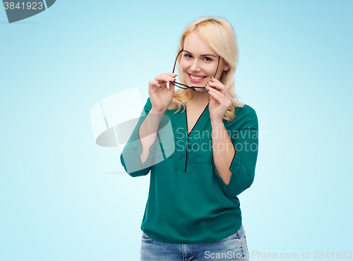 Image of smiling young woman with eyeglasses