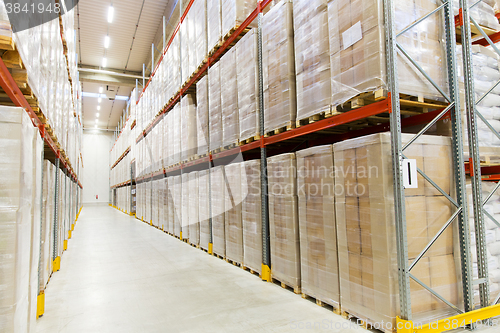 Image of cargo boxes storing at warehouse shelves