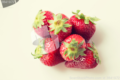 Image of juicy fresh ripe red strawberries on white
