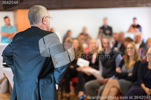 Image of Speaker at Business Conference and Presentation.