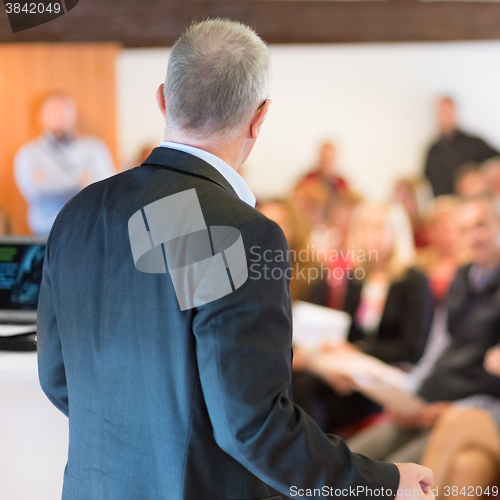 Image of Speaker at Business Conference and Presentation.