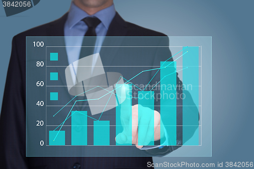 Image of Businessman Touching a Graph Indicating Growth. business concept 