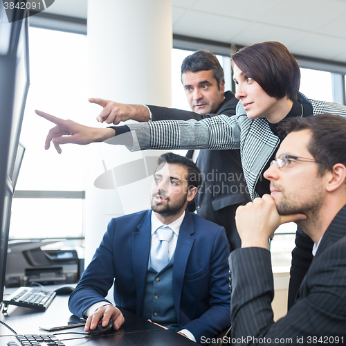 Image of Business team working in corporate office.