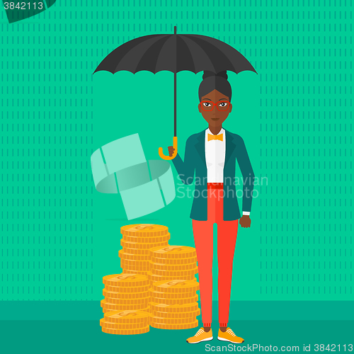 Image of Woman with umbrella protecting money.