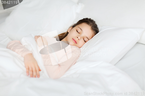 Image of girl sleeping in bed at home