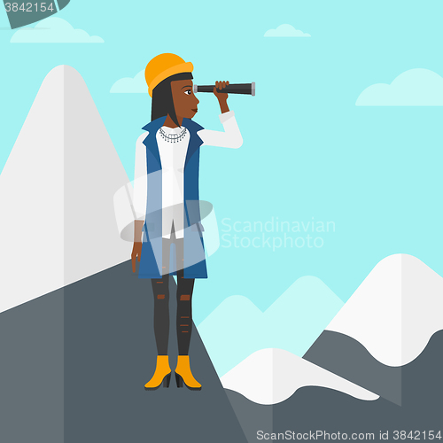 Image of Business woman looking through spyglass.