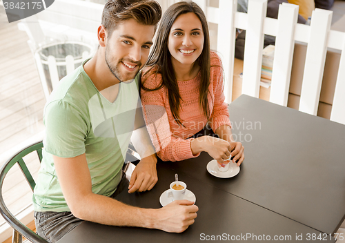 Image of Young couple drinking coffee