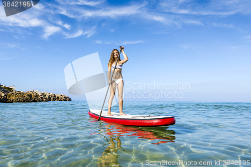 Image of Woman practicing paddle