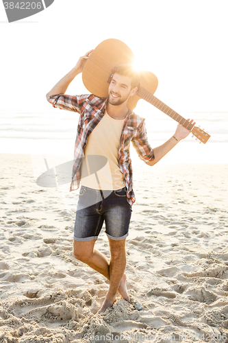 Image of Handsome young man at the beach