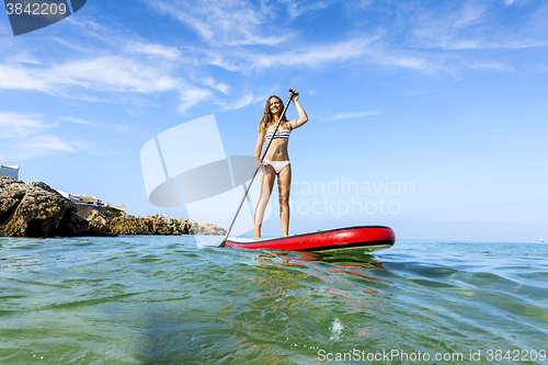 Image of Woman practicing paddle