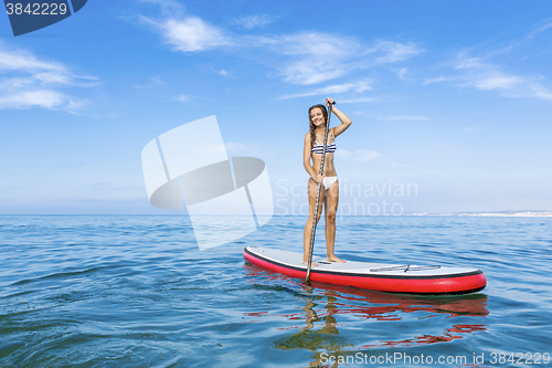 Image of Woman practicing paddle