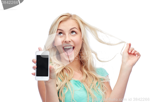 Image of happy young woman or teenage girl with smartphone