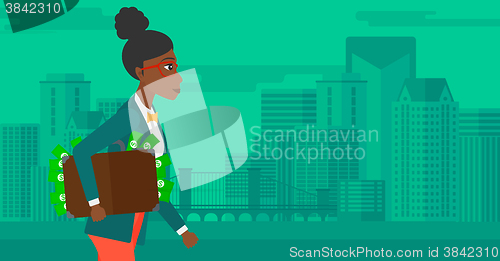 Image of Woman with suitcase full of money.