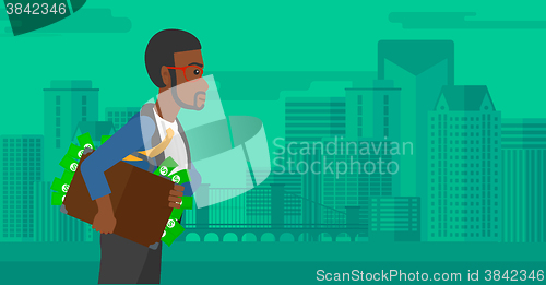 Image of Man with suitcase full of money.