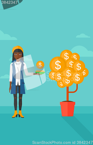 Image of Woman catching dollar coins.