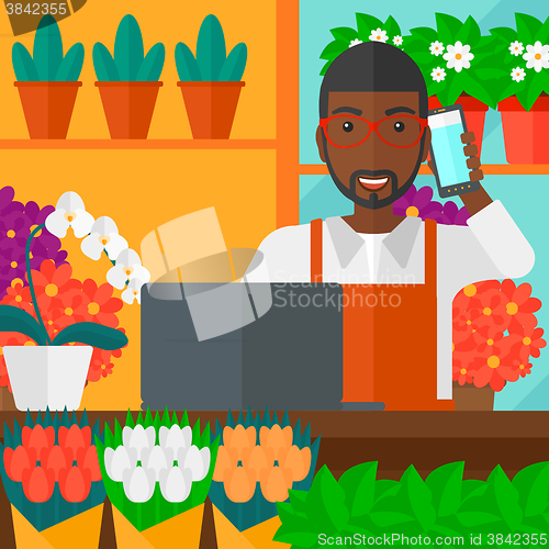 Image of Florist taking order.