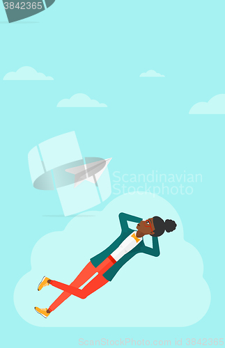 Image of Business woman relaxing on cloud.