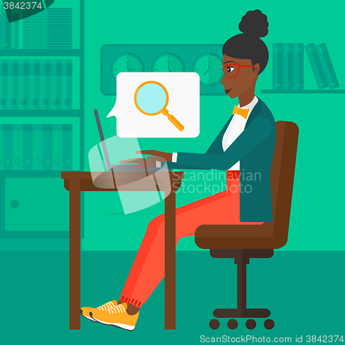 Image of Woman working in office.