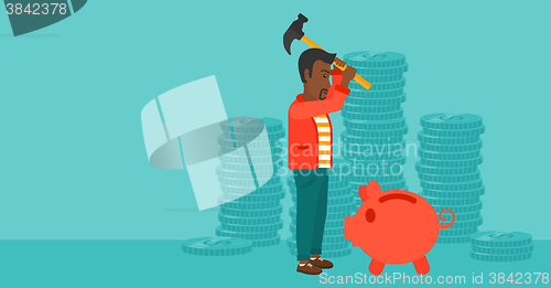 Image of Man breaking piggy bank.