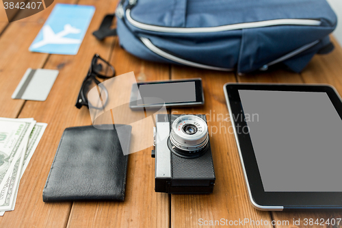 Image of close up of camera, gadgets and travel stuff