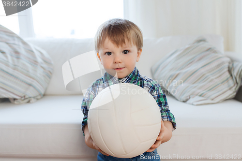 Image of happy little baby boy with ball at home