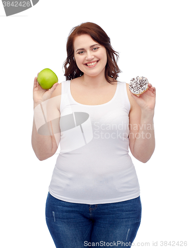 Image of happy plus size woman choosing apple or cookie