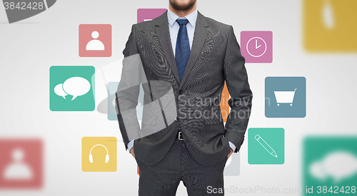 Image of close up of businessman in suit with menu icons